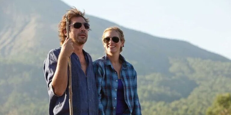 Elizabeth and Felipe share a moment together as they walk through the mountainous landscape of Bali. Both smile, reflecting the connection and joy they find in this final stage of Elizabeth's journey toward love and personal fulfillment.